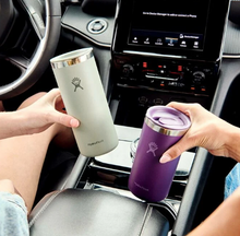 Load image into Gallery viewer, Two people holding gray and purple Hydro Flask tumblers in a car.